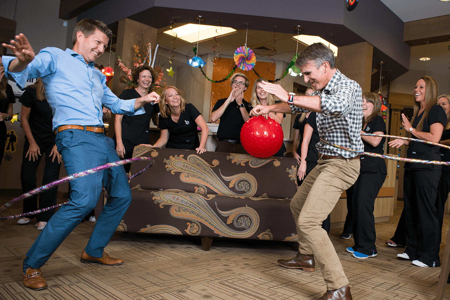 Orthodontists and team hula hooping