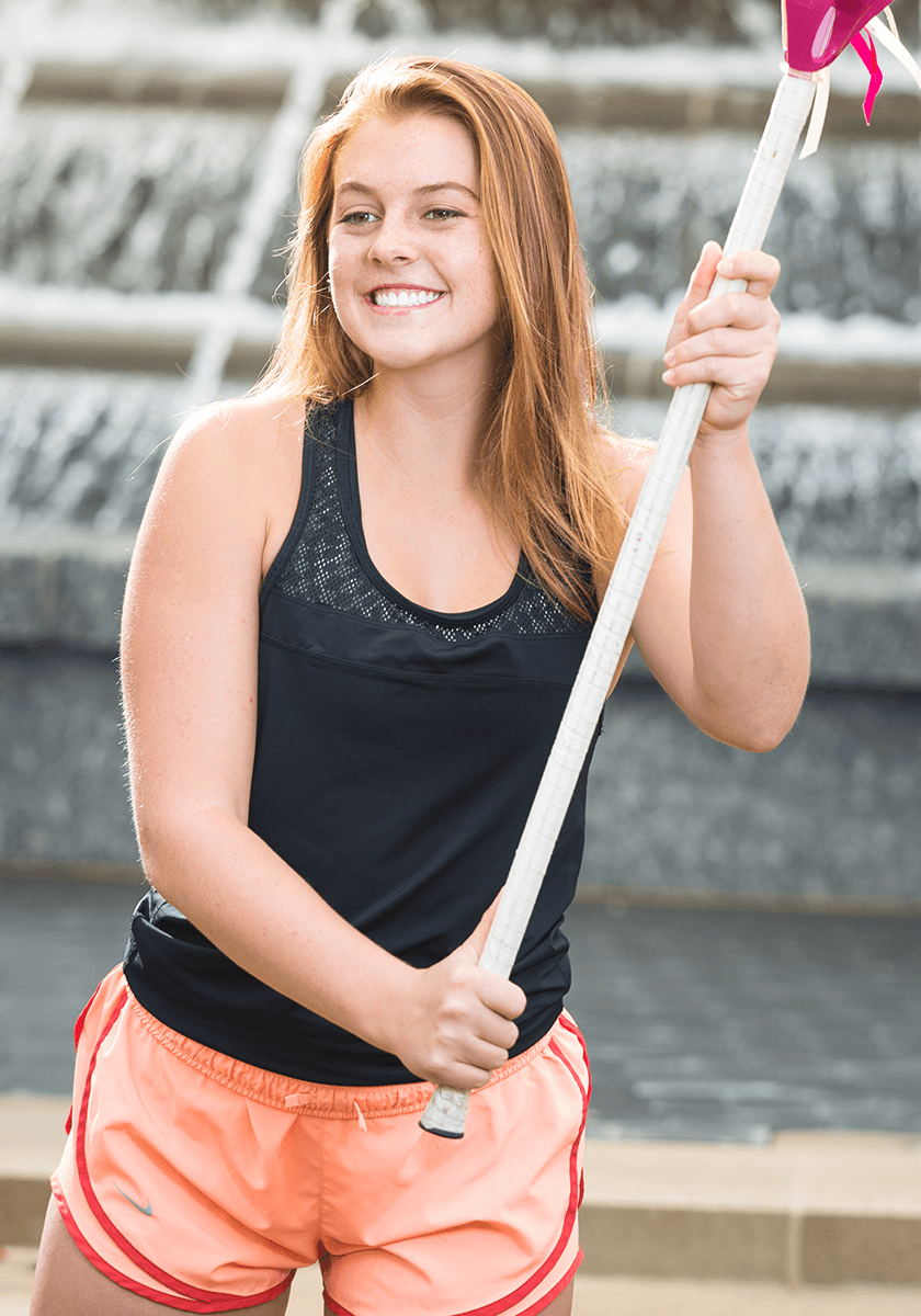 High school braces patient with lacrosse stick