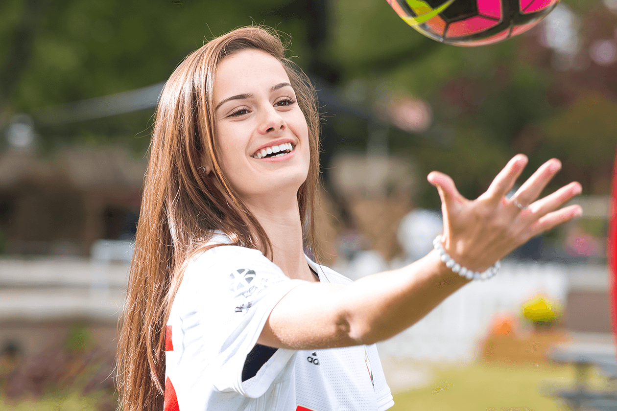 Soccer Player holding ball