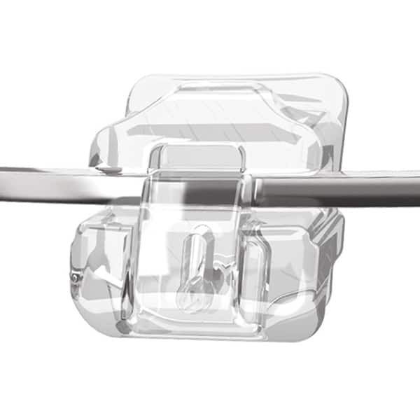 A close up of a Damon Clear braces bracket. The bracket is clear and is holding a wire in place.