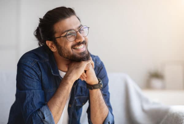 Portrait,Of,Smiling,Indian,Man,With,Eyeglasses,And,Braces,In
